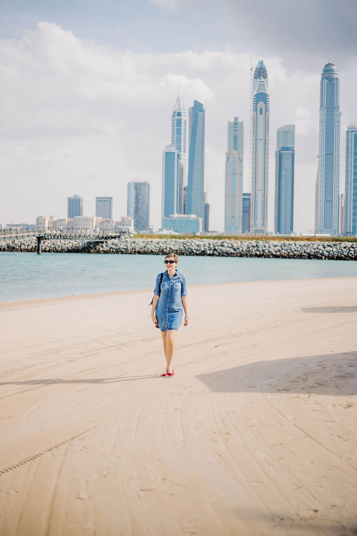 walking by the private beach at one and only hotel in Dubai