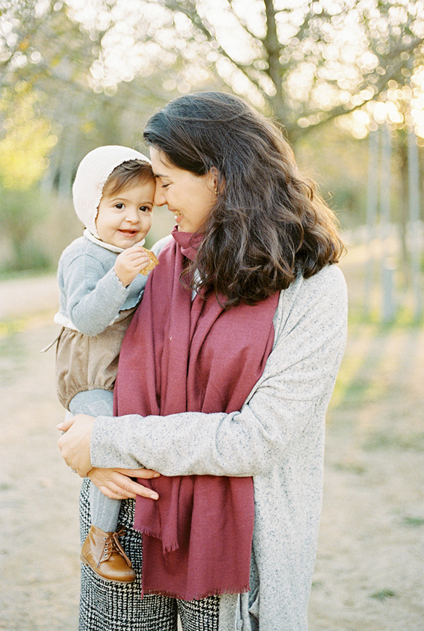 Mother with her baby girl smiling and having fun during the golden hour Barcelona family photosession