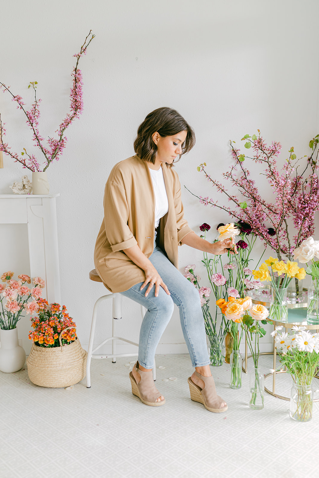 luxury floral designer working in the studio prepearing floral arragements