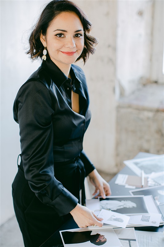 Business lady wearing black elegant outfit workinf in her branding studio
