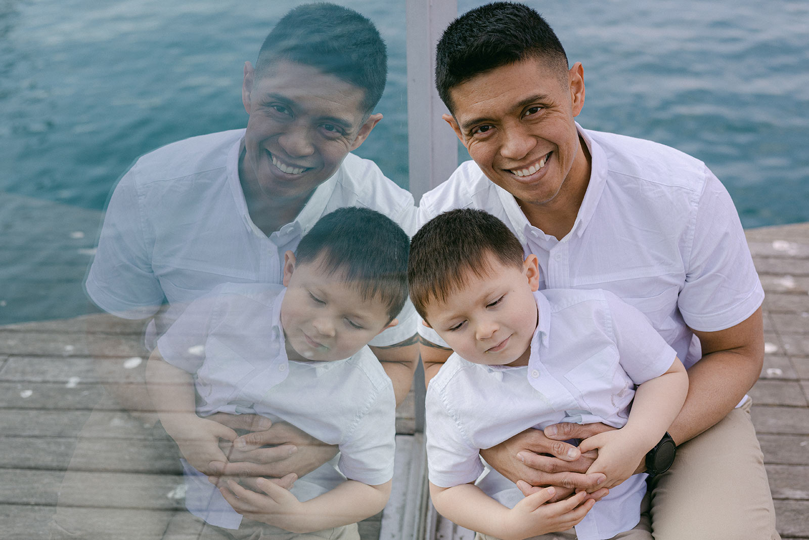 Dad and son beautiful portrait in the Port Vell of Barcelona, Gothic Quarter family photography