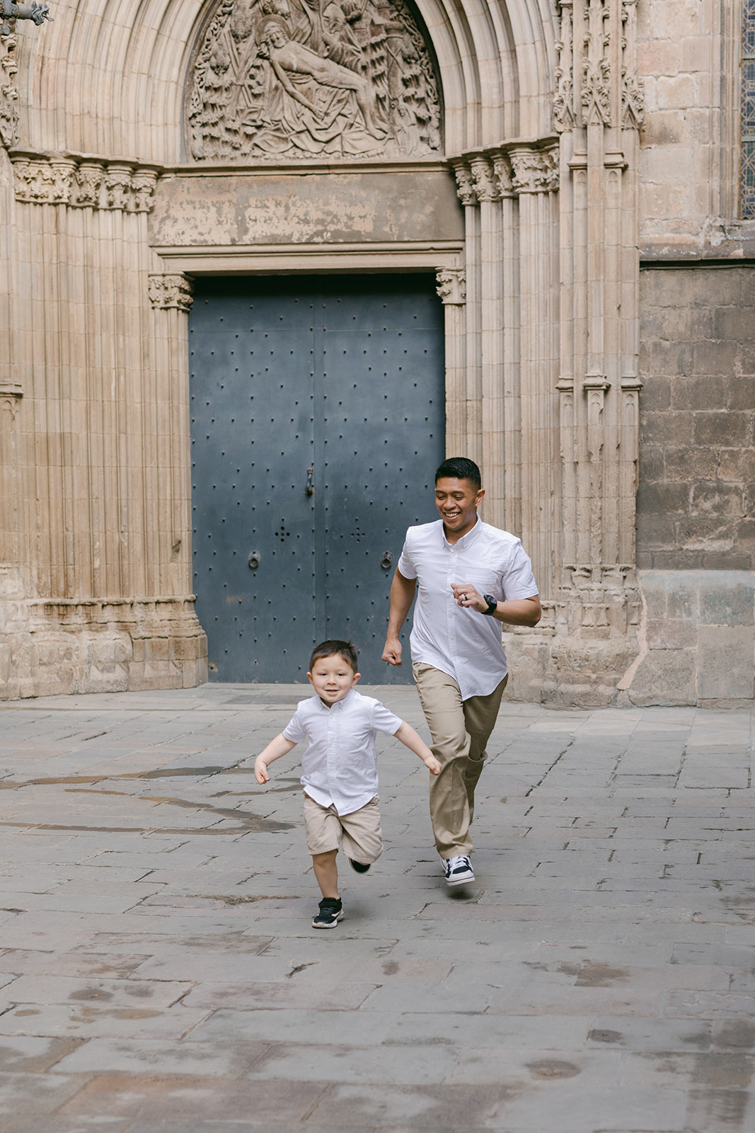 Dad and son walking next to Barcelona Cathedral, during the the Gothic Quarter Family Photography