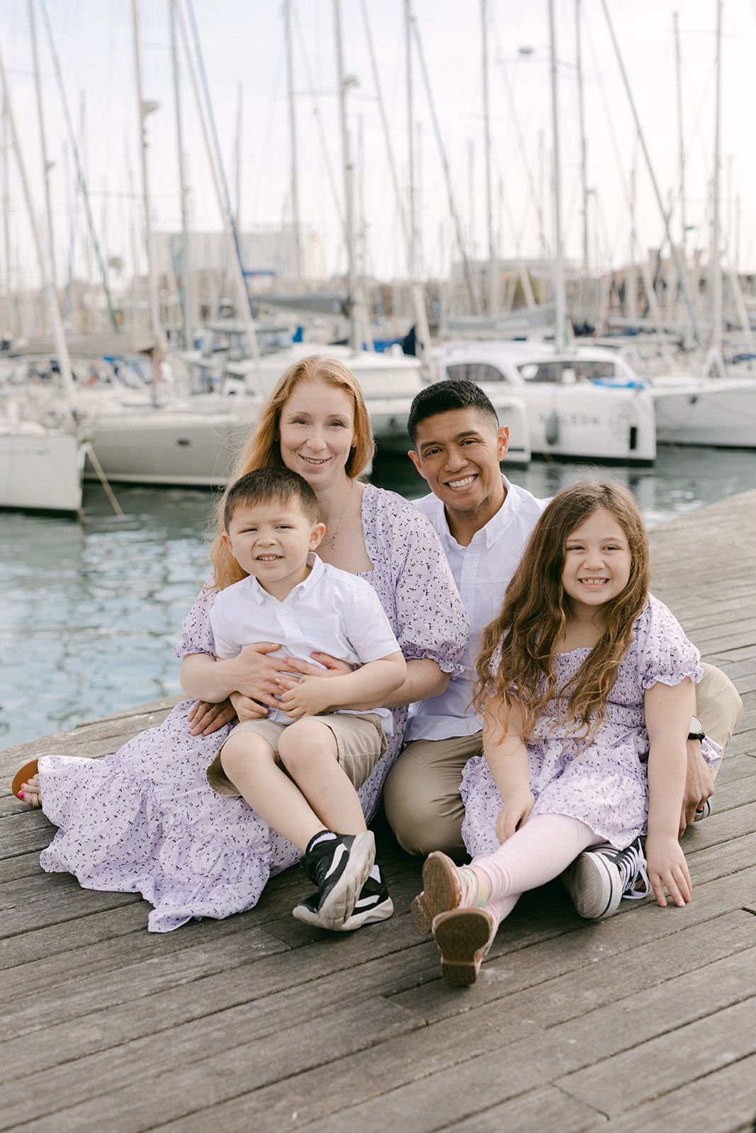 Beautiful family portrait of four in the Port Vell, during the Gothic Quarter Family Photography
