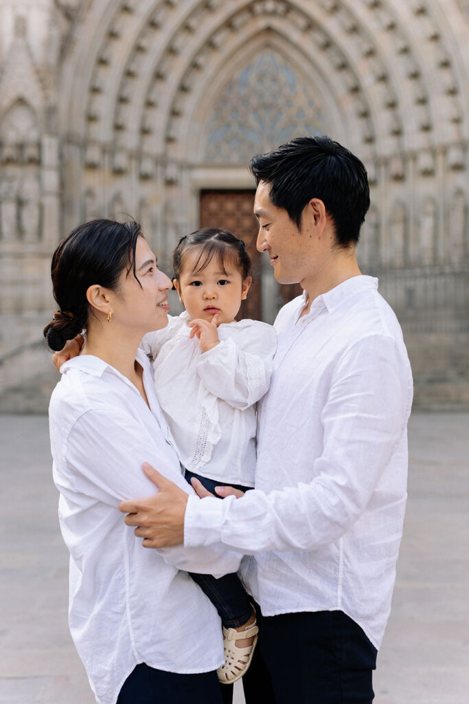 portrait of japaneese family with toddler girl, wearing white and black outfits