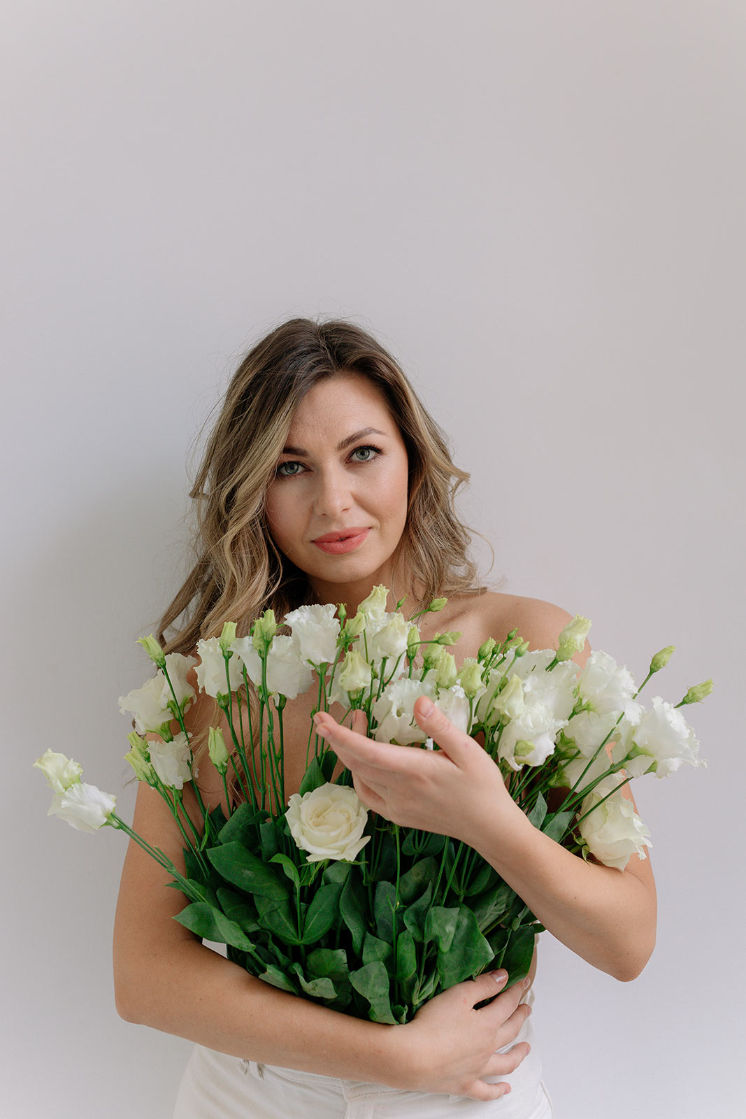 beautiful young woman with wearing white flowers as a top