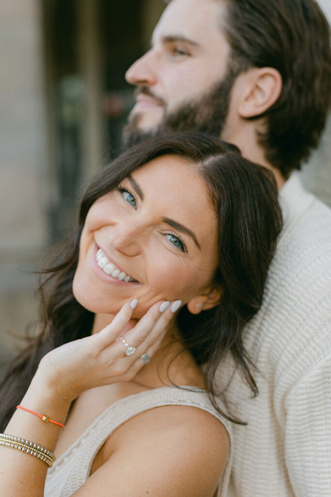 Close up portrait of a young woman right after the surprise proposal in BArcelona showing her engagement ring