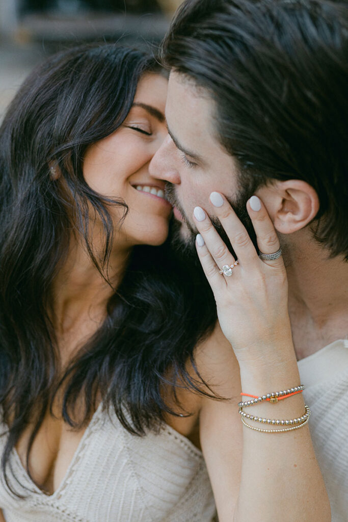 Close up portrait of youang kissing couple after the surprise proposal in Barcelona