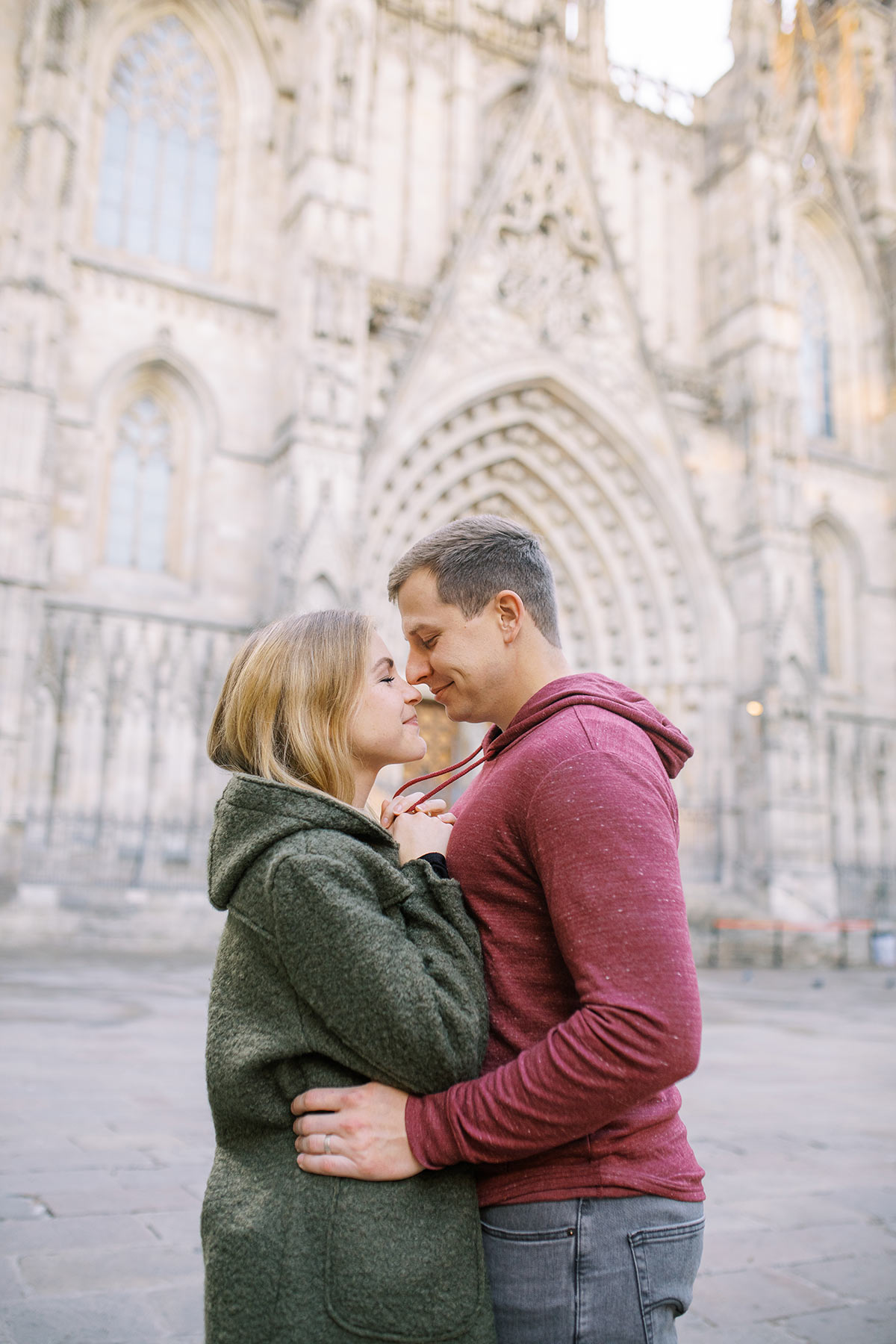 Young couple during the honeymoon photoshoot in Barcelona's Gothic quarter