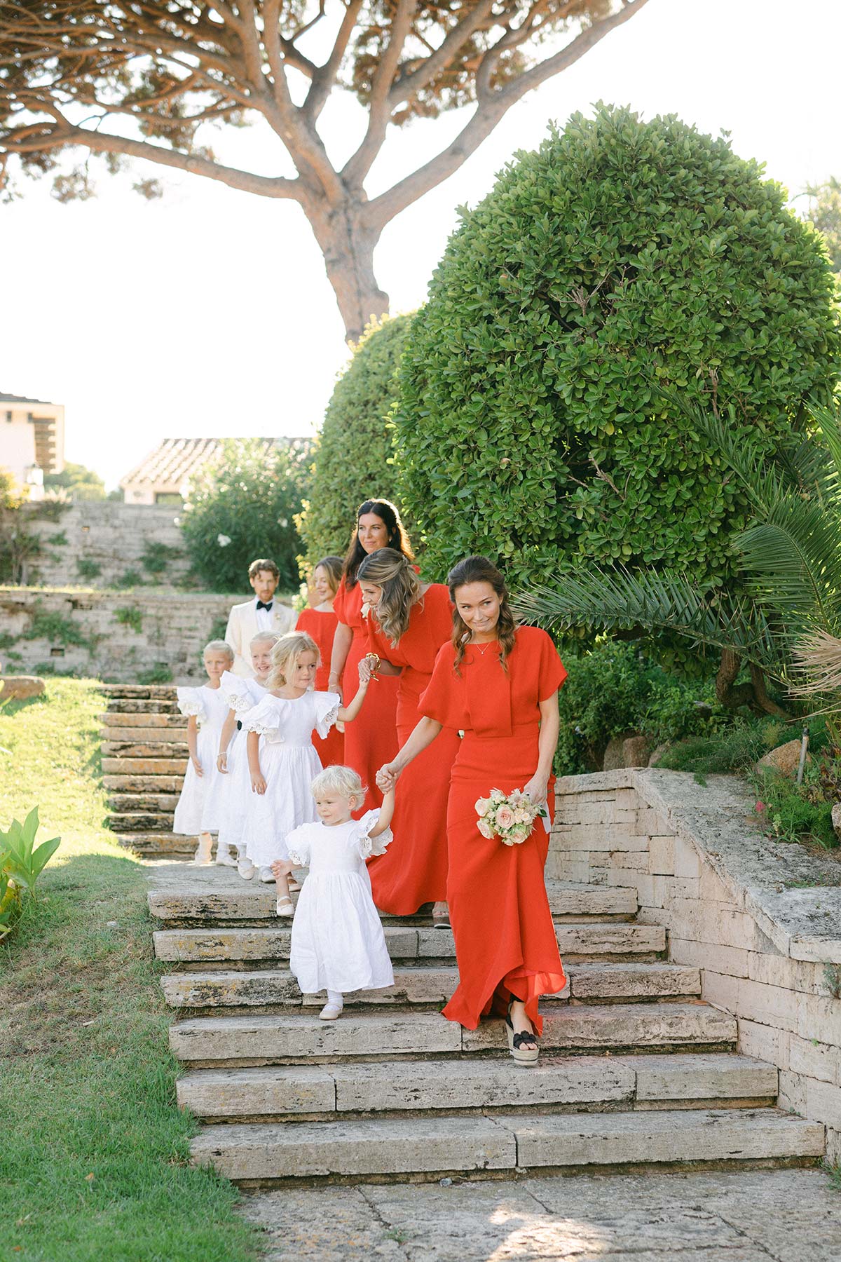 Bridemaids walking to the ceremony - Lena Karelova Photography Wedding at Luxury Hotel in Spain