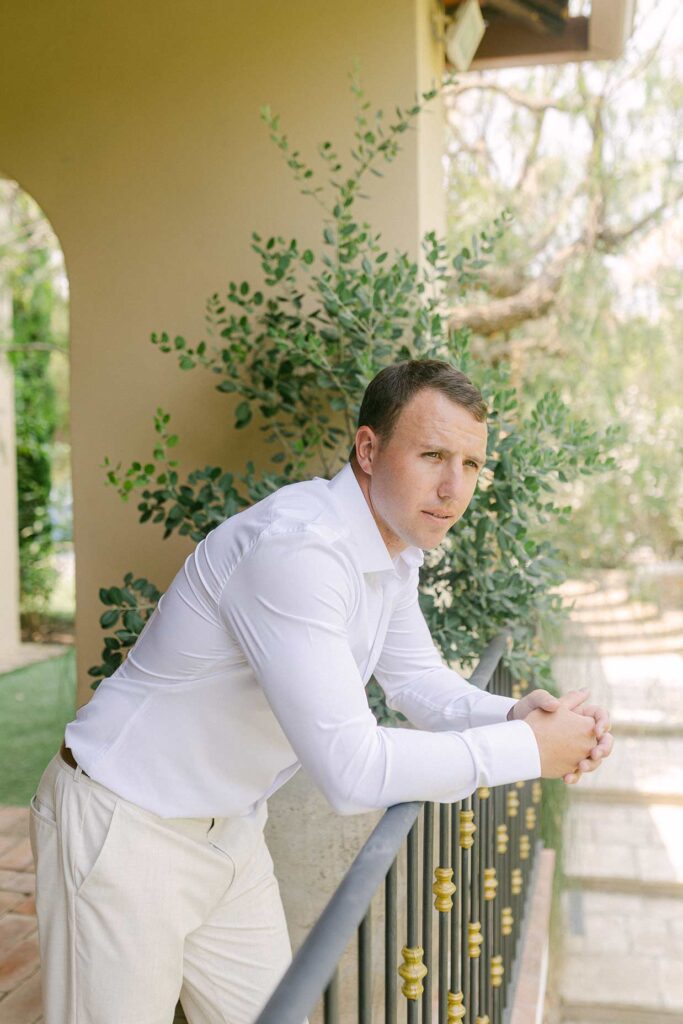 Groom portrait at a Mediterranean villa during a wedding in Sitges, Spain.