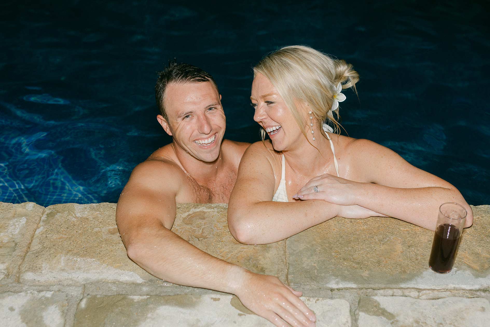 Pool party after reception at Mediterranean villa wedding near Barcelona