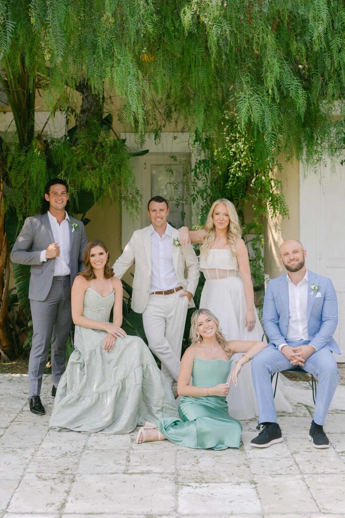 Bridal party portrait at a private villa wedding in Barcelona surrounded by Mediterranean greenery.