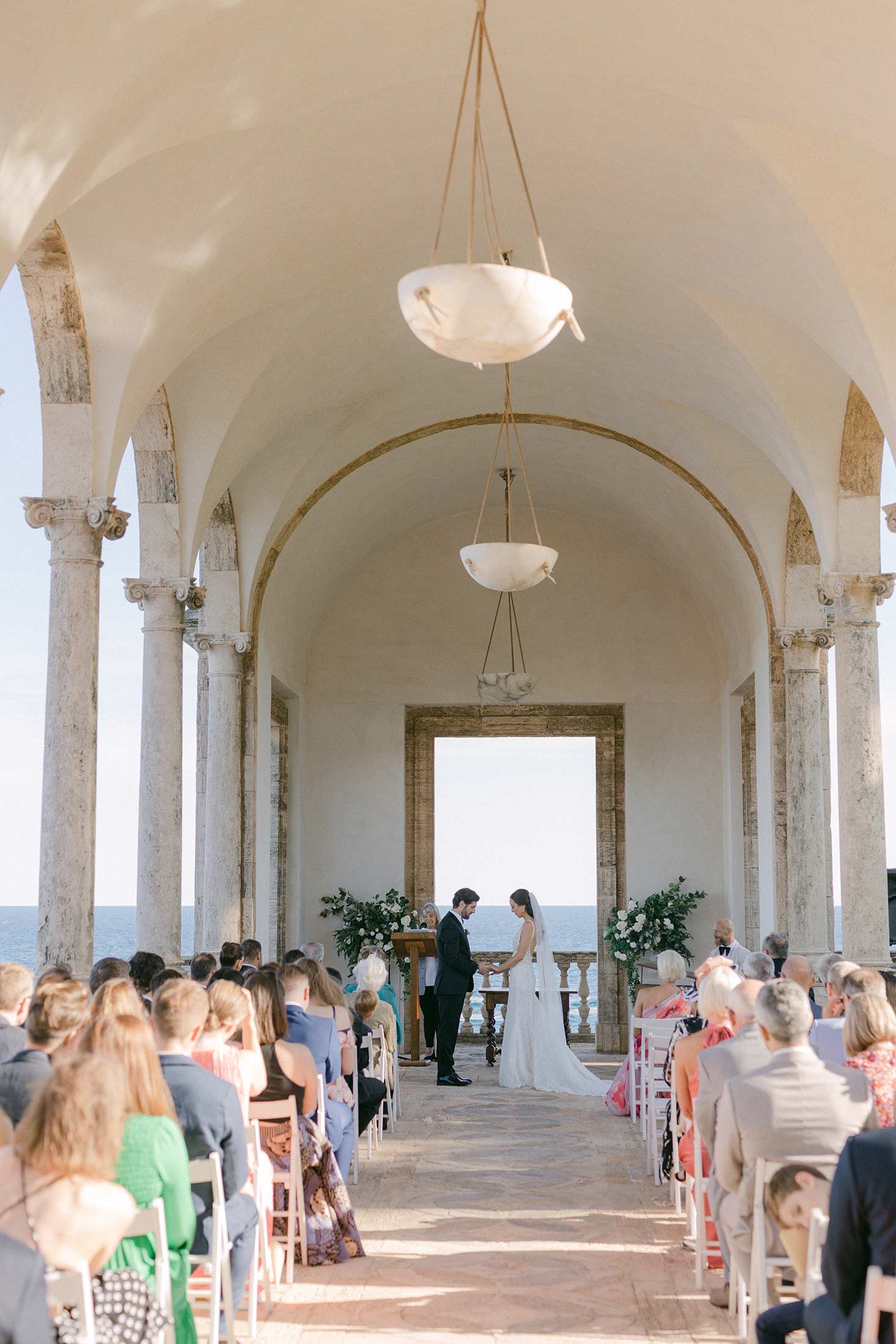Wide view of the wedding ceremony at Hostal La Gavina with sea views in Costa Brava