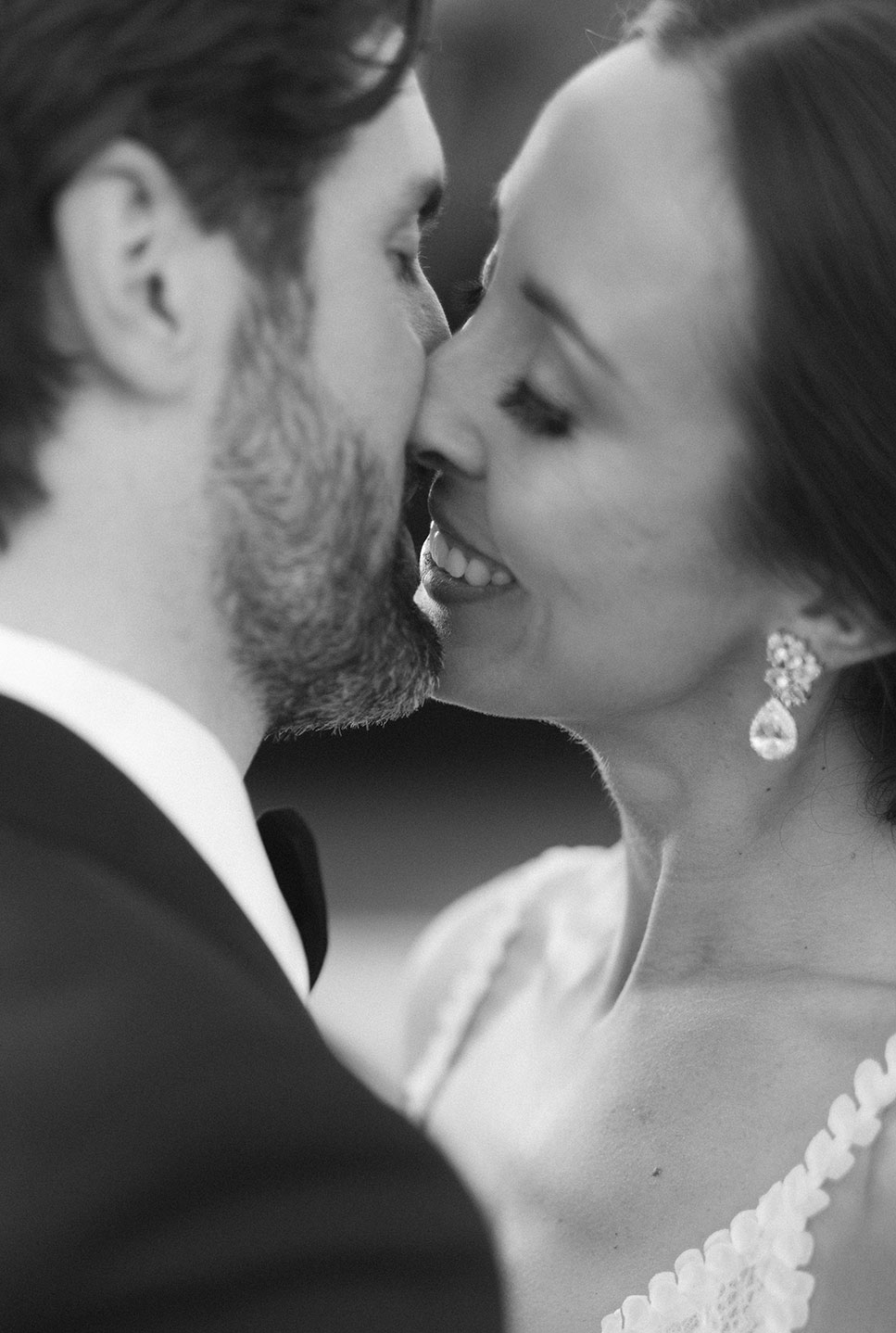 Intimate black and white close-up of the bride and groom about to kiss at their Costa Brava wedding