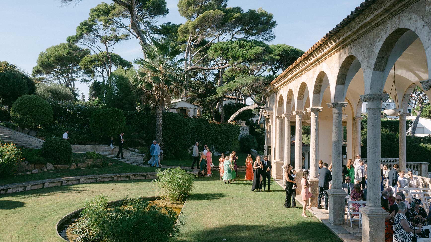 Guests arriving at the La Senya Blanca ceremony space at Hostal La Gavina in Costa Brava