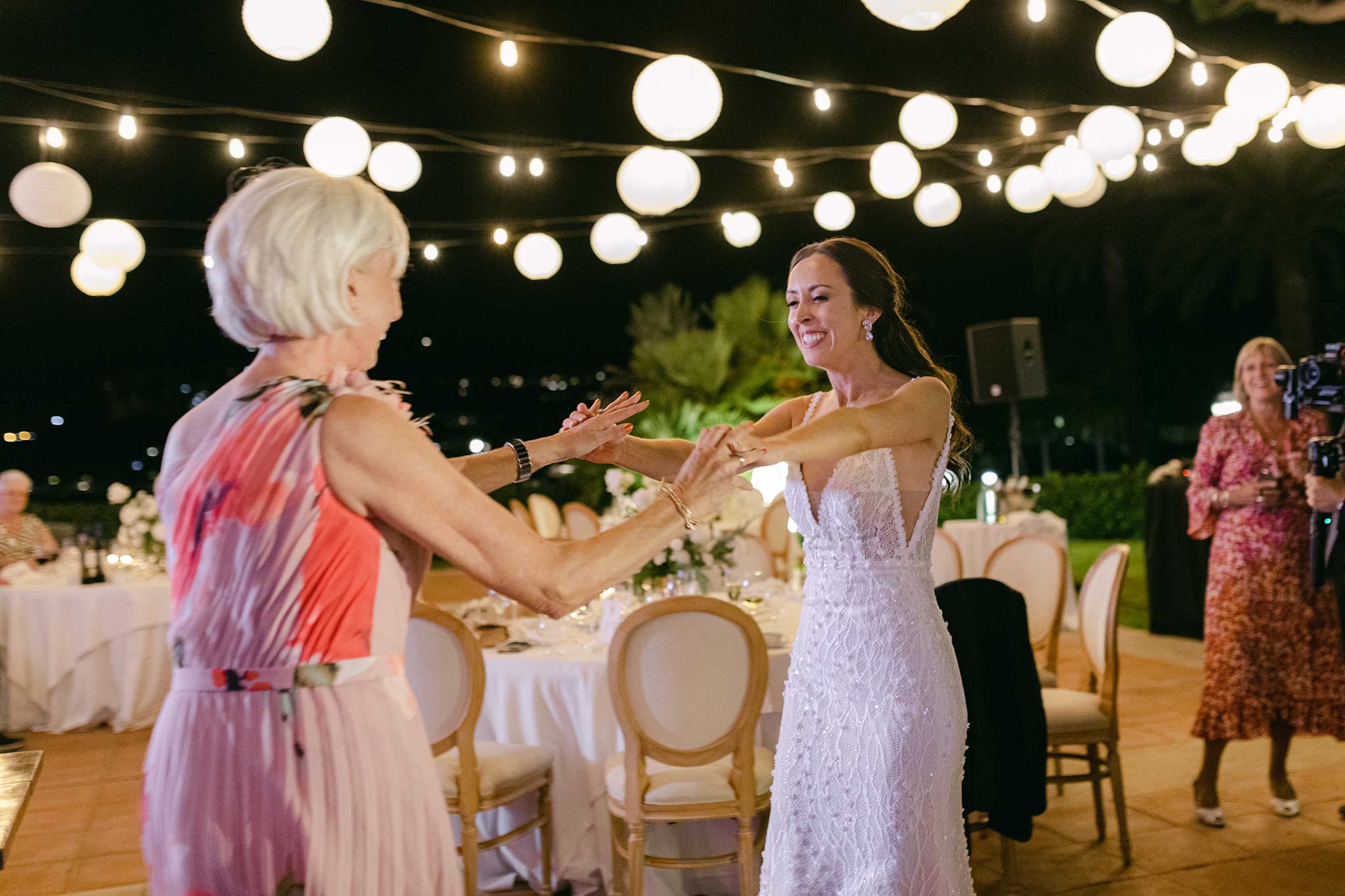 bride dancing with her mother at reception at Hostal La Gavina; Costa Brava destination wedding photography