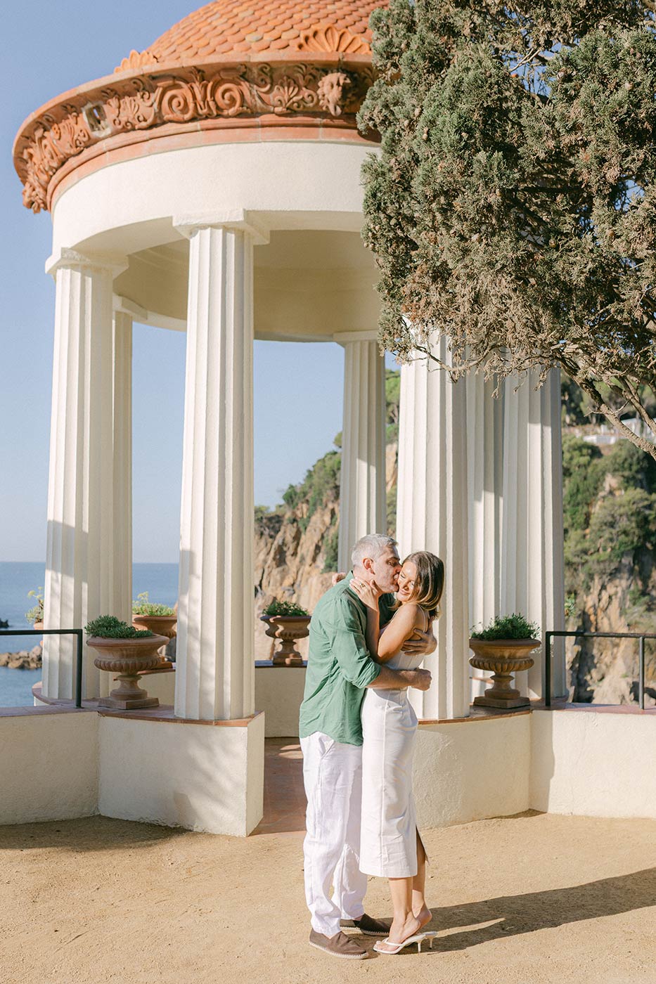 Just engaged couple huging next to the Temple of Linnaeus at Marimurtra Garden , Costa Brava proposal ideas